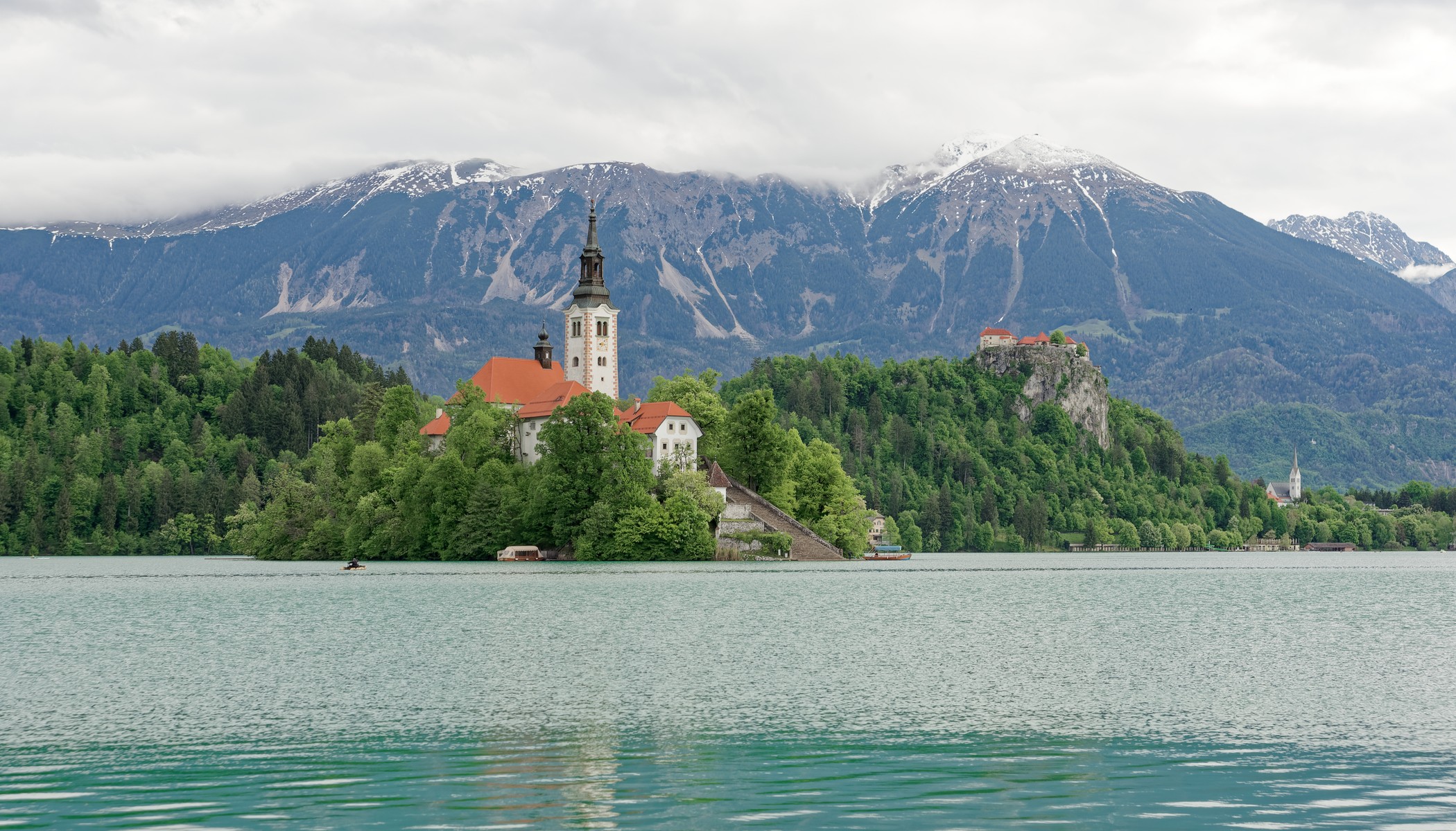 Lake Bled’s island church and castle beneath the Julian Alps.